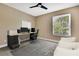 Cozy office space with a computer, white board, desk, and comfortable seating for a functional work environment at 3241 Evening Breeze Loop, Wesley Chapel, FL 33544