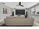 Media room with projector screen, surround sound, comfortable seating and wood-look flooring at 3241 Evening Breeze Loop, Wesley Chapel, FL 33544