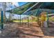 A colorful playground with swings, slides, and picnic tables under a shaded structure at 3241 Evening Breeze Loop, Wesley Chapel, FL 33544