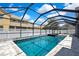 Private backyard pool with screened-in lanai for year-round enjoyment, attached spa, and ample space at 3241 Evening Breeze Loop, Wesley Chapel, FL 33544