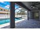 Private backyard pool with screened-in lanai, spa, and a paved deck at 3241 Evening Breeze Loop, Wesley Chapel, FL 33544