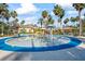 Community splash pad with palm trees and colorful water features at 3241 Evening Breeze Loop, Wesley Chapel, FL 33544