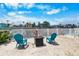 Outdoor seating area with fire pit and direct access to canal at 3260 Gulfview Dr, Hernando Beach, FL 34607