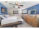 Bedroom featuring wood-look wall paneling, blue walls, and light-colored wood furniture at 3260 Gulfview Dr, Hernando Beach, FL 34607
