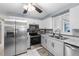 Modern kitchen with stainless steel appliances and ample cabinet space at 3260 Gulfview Dr, Hernando Beach, FL 34607