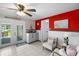 Bright kitchenette with white cabinets and outdoor access to the patio at 3260 Gulfview Dr, Hernando Beach, FL 34607