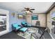 Relaxing sunroom with vibrant turquoise seating, perfect for enjoying serene views and natural light at 3260 Gulfview Dr, Hernando Beach, FL 34607