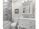 Bathroom with updated vanity, frameless glass shower and modern fixtures at 3323 Fox Hunt Dr, Palm Harbor, FL 34683