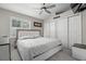 Bedroom with updated closet doors, ceiling fan, and modern furniture at 3323 Fox Hunt Dr, Palm Harbor, FL 34683