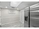 Kitchen area with stainless steel refrigerator and sliding glass doors at 3323 Fox Hunt Dr, Palm Harbor, FL 34683
