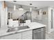 Kitchen with marble countertops, stainless steel appliances, and eat-in bar at 3323 Fox Hunt Dr, Palm Harbor, FL 34683