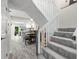 View from the stairs looking into the dining room, kitchen, and hallway at 3323 Fox Hunt Dr, Palm Harbor, FL 34683