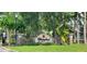 Stone entrance sign for Waterford Condominium Residences in a landscaped setting at 3493 Kings Rd # 106, Palm Harbor, FL 34685