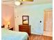 Bedroom featuring hardwood floors, dresser, and closet at 3575 Lake Highland Dr, Palm Harbor, FL 34683