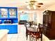 Traditional dining room with a wooden table and chairs, plus a vintage china cabinet, and view into the living room at 3575 Lake Highland Dr, Palm Harbor, FL 34683