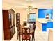Inviting dining room featuring traditional furnishings with an open view into the kitchen and living space at 3575 Lake Highland Dr, Palm Harbor, FL 34683