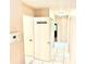 Hallway with tile flooring, linen closet, and access to rooms at 3575 Lake Highland Dr, Palm Harbor, FL 34683