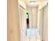 Hallway featuring tile flooring and multiple storage closets at 3575 Lake Highland Dr, Palm Harbor, FL 34683