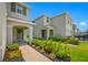 Charming townhomes featuring beautiful landscaping and a welcoming front porch at 36652 N Spanish Rose Dr, Dade City, FL 33525