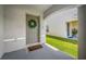 A lovely doorway with a wreath and welcome matt at 36652 N Spanish Rose Dr, Dade City, FL 33525