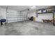 Spacious two car garage with a white door and plenty of room for storage and parking at 36652 N Spanish Rose Dr, Dade City, FL 33525