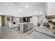 Stylish kitchen featuring stainless appliances, granite countertops, and a center island with seating at 36652 N Spanish Rose Dr, Dade City, FL 33525