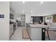 Modern kitchen with stainless steel appliances, granite countertops, and an island with bar seating at 36652 N Spanish Rose Dr, Dade City, FL 33525