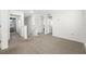 Upstairs landing with carpet flooring and multiple doorways leading to bedrooms at 36652 N Spanish Rose Dr, Dade City, FL 33525
