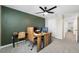 Office features green accent wall, neutral carpet, desk, and modern computer equipment at 36652 N Spanish Rose Dr, Dade City, FL 33525
