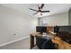 Office space with neutral carpet, a desk, and a window for natural light at 36652 N Spanish Rose Dr, Dade City, FL 33525