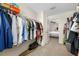 A full walk-in closet with many clothes racks at 36652 N Spanish Rose Dr, Dade City, FL 33525