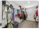 A large walk-in closet with plenty of hanging space and shelving at 36652 N Spanish Rose Dr, Dade City, FL 33525