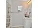 Bathroom vanity with neutral walls and vanity mirror at 3714 N Garrison St, Tampa, FL 33619