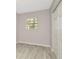 Empty bedroom with wood-style floors and a closet at 3714 N Garrison St, Tampa, FL 33619