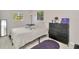 A bright bedroom offers a comfortable living space with natural light and modern accents at 3714 N Garrison St, Tampa, FL 33619