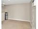 A small room with tile floors and small refrigerator, ideal for a kitchenette or office at 3714 N Garrison St, Tampa, FL 33619