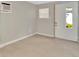 Neutral room with tile floors, a large window, and an AC unit perfect for relaxing at 3714 N Garrison St, Tampa, FL 33619