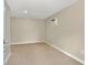 A versatile room with tile flooring and neutral walls, featuring an AC unit for comfort at 3714 N Garrison St, Tampa, FL 33619