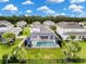 Aerial view showcases the property's pool, screened enclosure, and spacious backyard at 4080 Bonfire Dr, Odessa, FL 33556