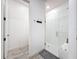 Bright bathroom features a glass enclosed shower and tile flooring at 4080 Bonfire Dr, Odessa, FL 33556