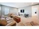 Spacious living room features plush seating, television, and decorative furnishings at 4080 Bonfire Dr, Odessa, FL 33556