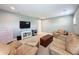 Cozy living area boasts comfortable seating, a television, and stylish accents at 4080 Bonfire Dr, Odessa, FL 33556