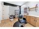 Hair salon with salon chair, styling station, and storage shelving at 4080 Bonfire Dr, Odessa, FL 33556