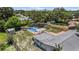 Aerial view features a backyard with a pool, carport, storage shed, and privacy fence, highlighting outdoor amenities at 4530 Catalonia S Way, St Petersburg, FL 33712