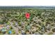 High-angle view of a residential community surrounded by lakes, mature trees and lush landscaping at 4530 Catalonia S Way, St Petersburg, FL 33712