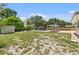 Spacious backyard featuring a sparkling pool and a charming pergola seating area, perfect for outdoor relaxation at 4530 Catalonia S Way, St Petersburg, FL 33712