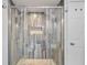 Bathroom features a wood-look tiled shower with dual shower heads at 4530 Catalonia S Way, St Petersburg, FL 33712