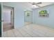 Bedroom boasting sliding mirror closet doors, and a ceiling fan at 4530 Catalonia S Way, St Petersburg, FL 33712