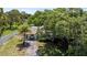 Charming single-story home with well-maintained landscaping, inviting front porch and long driveway at 4530 Catalonia S Way, St Petersburg, FL 33712