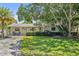 Charming single-story home with a well-maintained lawn and mature landscaping provides great curb appeal at 4530 Catalonia S Way, St Petersburg, FL 33712
